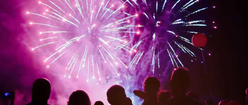 a crowd watching fireworks as part of sober New Year's ideas